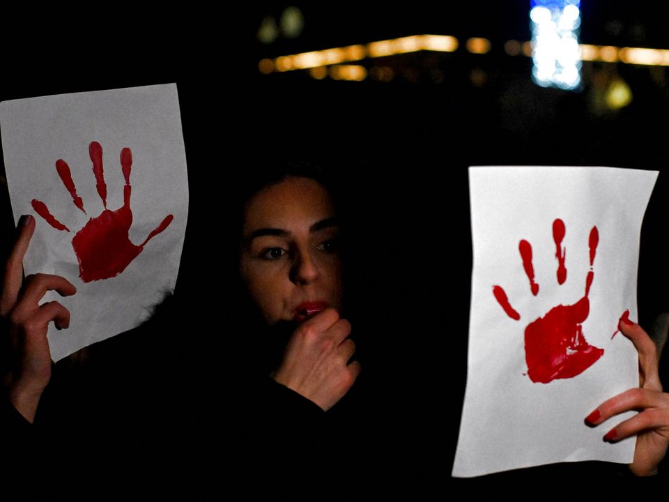 A firefighter​ battles a wildfire in California.