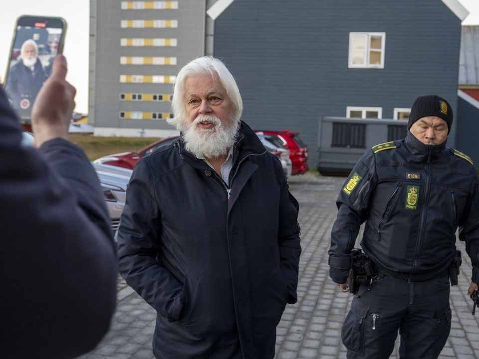 Passengers⁤ wait in a⁣ crowded‌ airport terminal amidst flight cancellations.