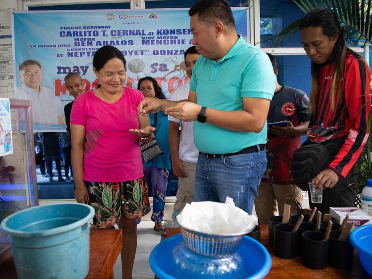 Villagers in the Philippines rewarding community members with pesos for every five mosquitoes collected.