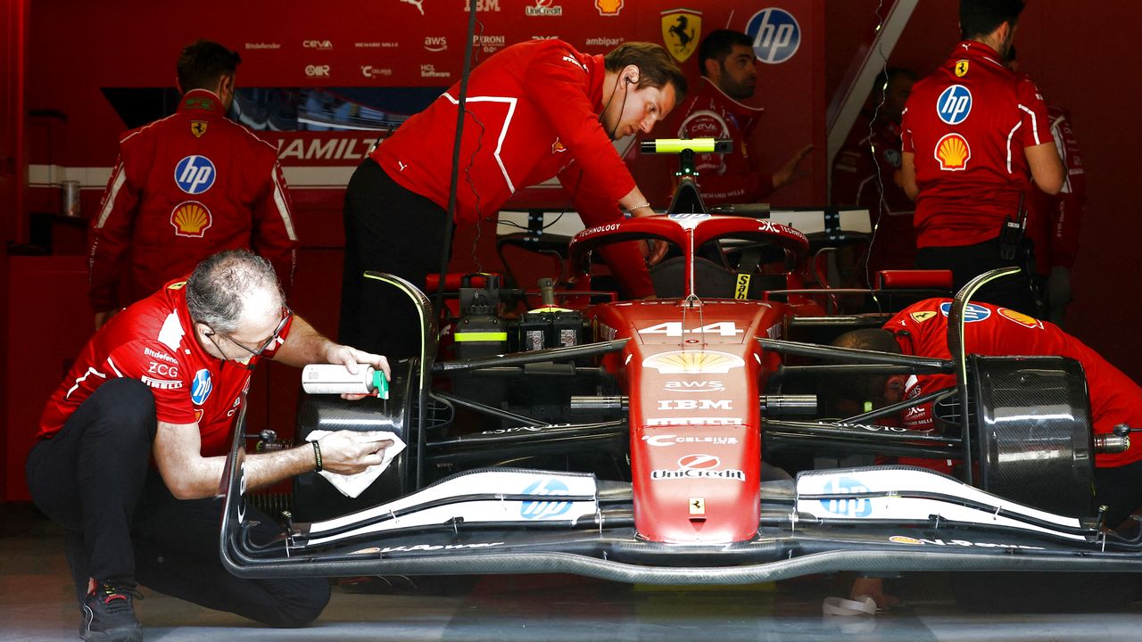 Lewis Hamilton's car being worked on during free practice in China