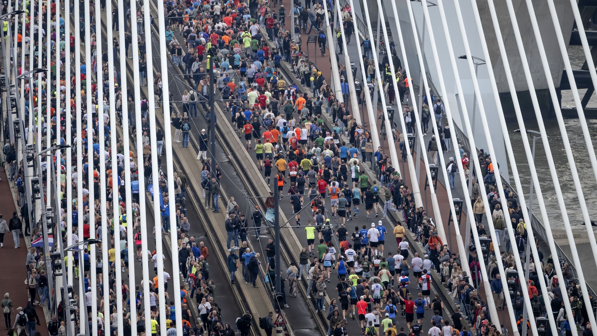 Runners passing the Erasmus Bridge during the Rotterdam Marathon