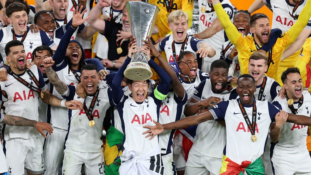 Son Heung-min lifting a trophy