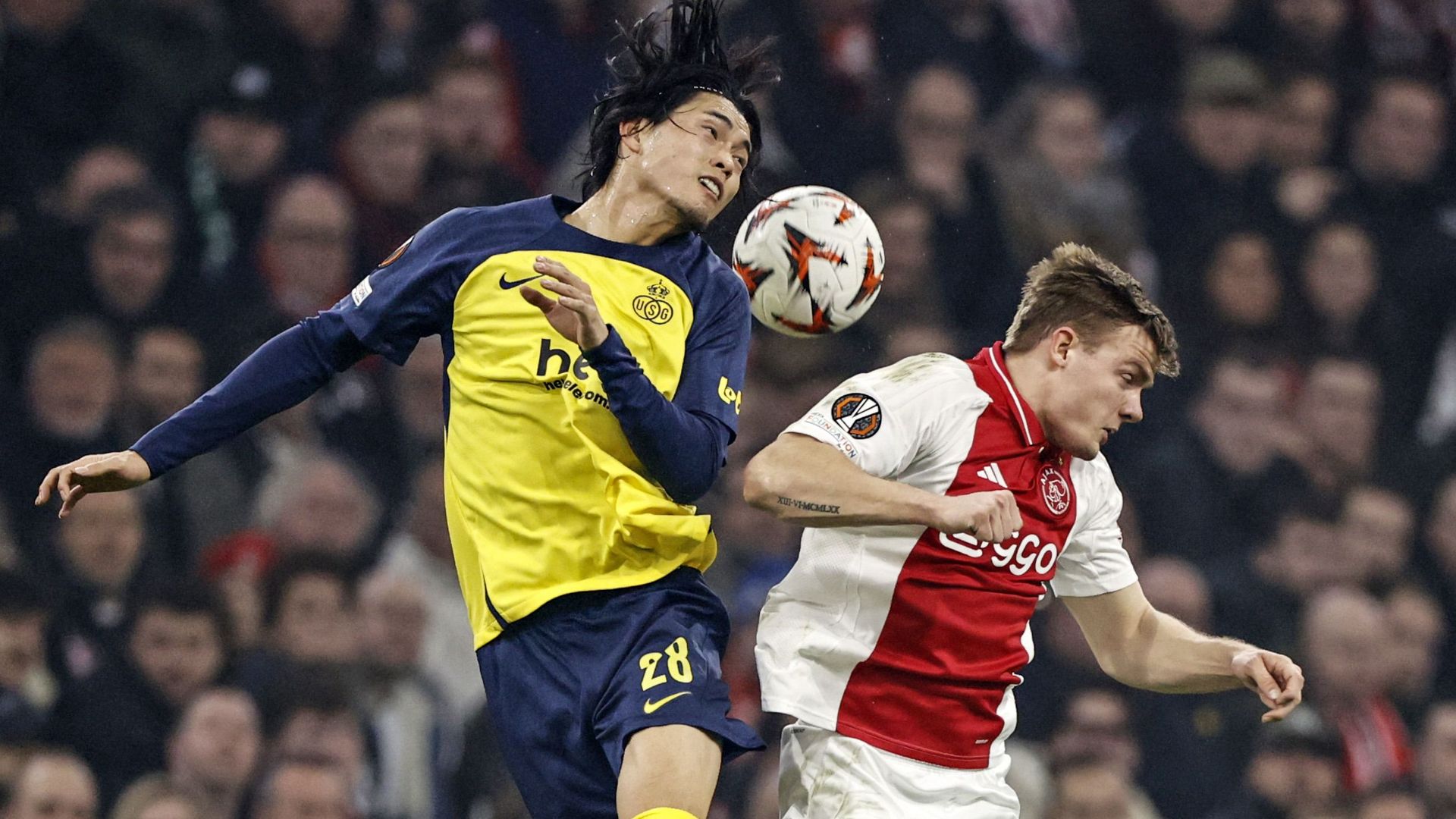 Koki Machida (Union Sint-Gillis) and Ajax player Christian Rasmussen battle for the ball