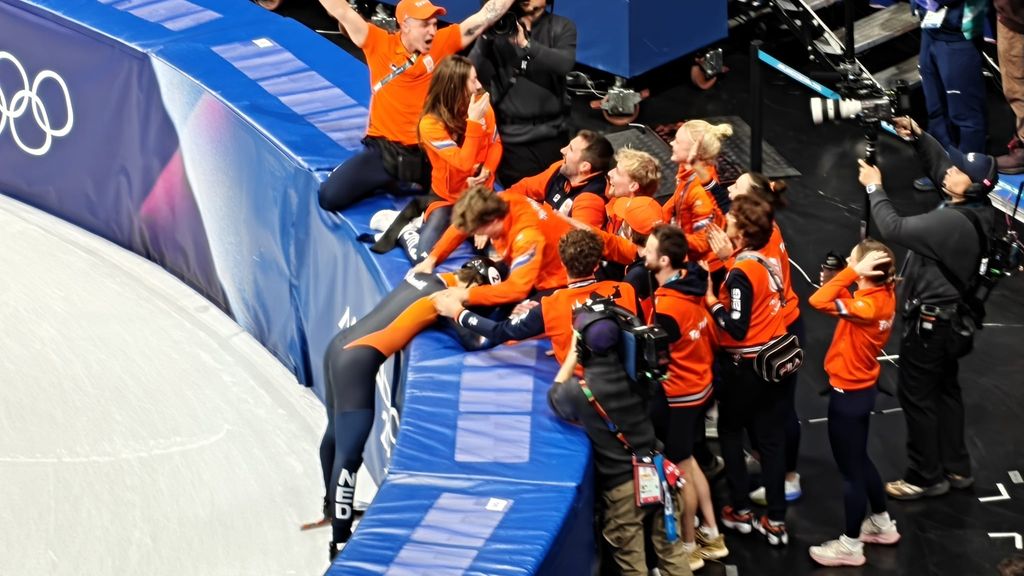 Jens van 't Wout of the Netherlands celebrates with his arms raised after winning the men's 1500m short track speed skating event at the Winter Olympics.